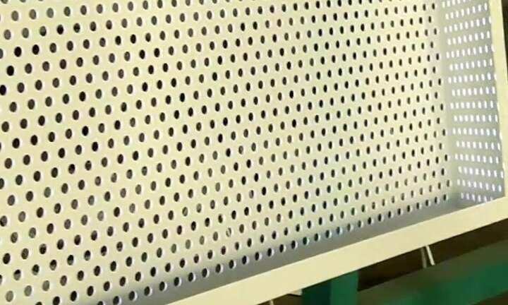 Architectural facade with medium-hole perforated plates enhancing ventilation and aesthetic appeal