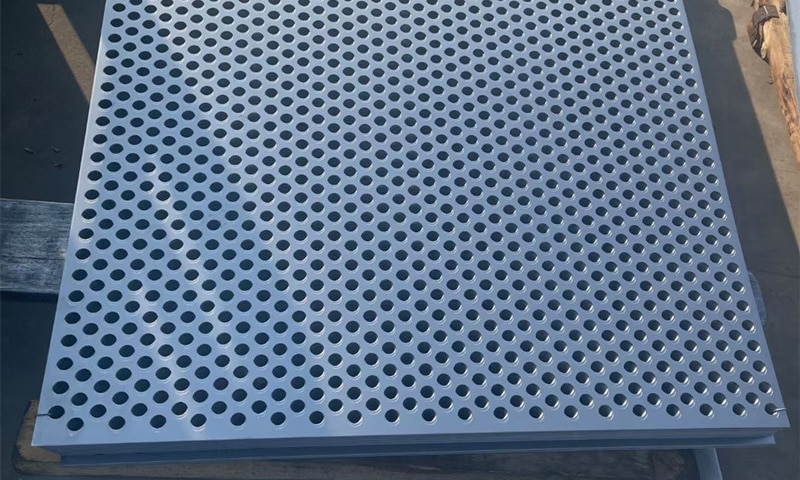 Stainless steel perforated plate with round holes in 60° staggered pattern